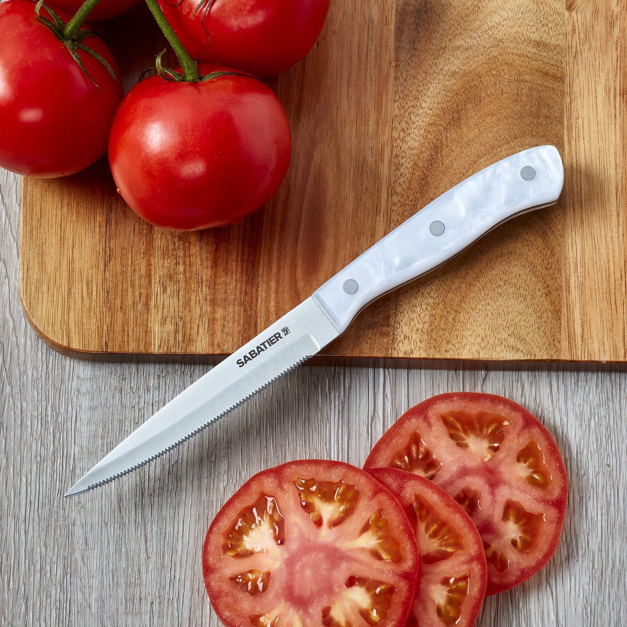 Sabatier Triple Riveted Serrated Utility Knife, 5-Inch, Razor-Sharp Kitchen Knife to Cut Fruit, Vegetables and more, High-Carbon Stainless Steel, White
