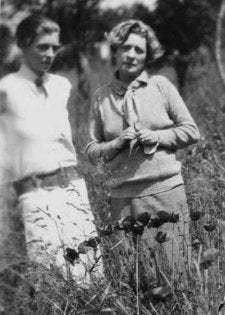 Nancy Cunard and Janet Flanner, three-quarter length portrait, standing among f2
